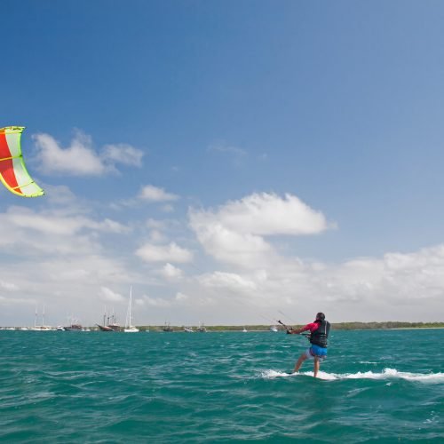 A man surfs with a kite on Bali